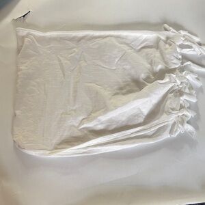 White type top with bows on the side